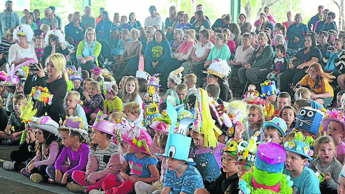 LEFT: Parents and students gathered for the end-of-term Easter hat parade.                                                     		         (sub)