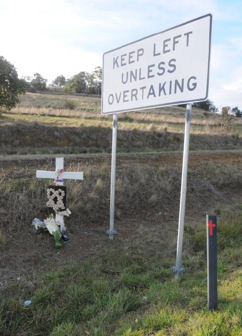 A memorial marks the site of the fatal crash on the Midland Highway.