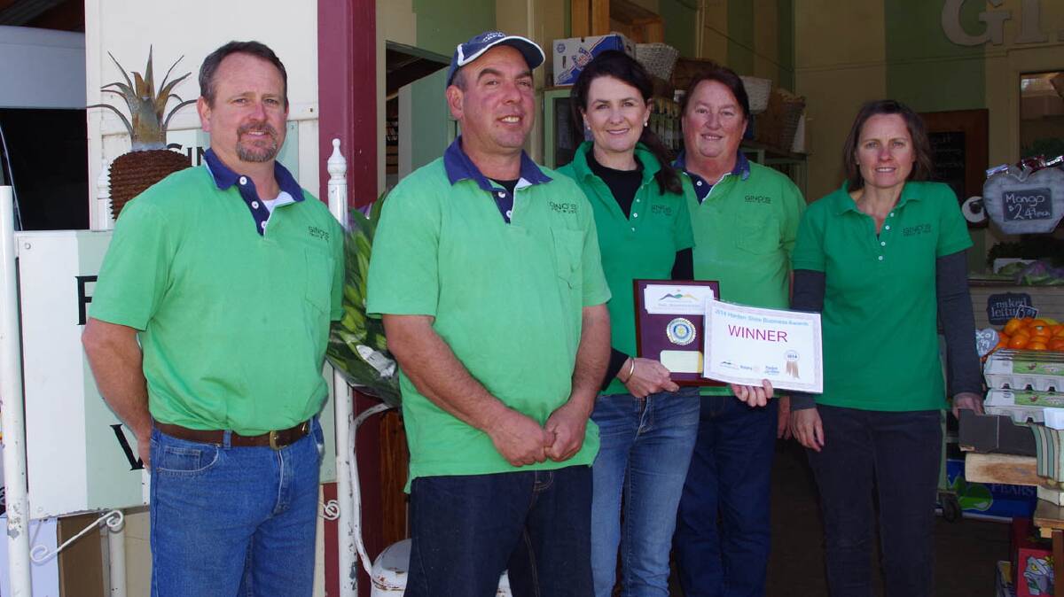  WORTHY WINNERS: Gino’s Fruit and Veg took out the Harden Chamber of Commerce and Industry’s major business award for 2014. Proudly displaying the award are (from left) Kevin Pedley, Gino and Jenny Polimeni, Anne Ford and Danielle Manton.

Photo: Harden Murrumburrah Express 
