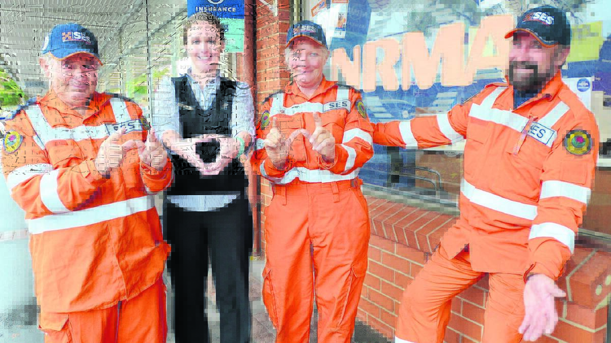 THE WOW FACTOR: Young SES deputy controller Barrie Miller, Young NRMA team leader Mikayla Basham, Young SES controller Colleen Clancy and Young SES team leader Colin Oliver are asking locals to wear orange tomorrow to raise awareness of SES volunteers.    