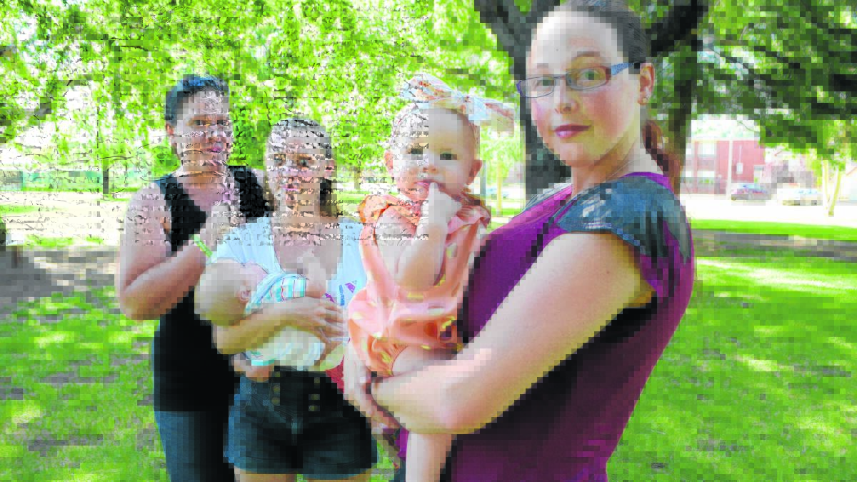 FED UP: Local mums and babies Natasha Baxter, Tysha and Zekeual Douglass (six months), and Katie and Savannah Fisher (eight months) are taking a stand against public breastfeeding discrimination after a series of confrontations over the past five months. 	