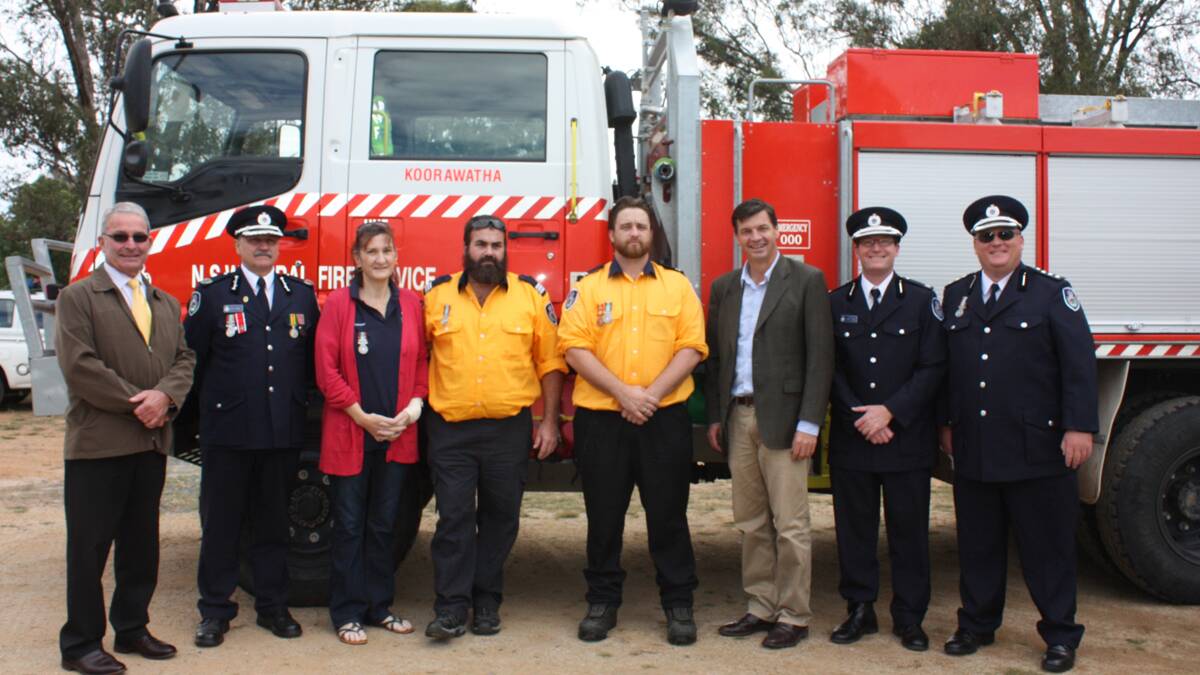 ABOVE: Koorawatha Brigade: RFS regional west manager Paul Smith, Young mayor Cr Stuart Freudenstein, NSW Rural Fire Service Assistant Commissioner Stuart Midgley, Leeanne and Mark Savva, Adam Reilly, Federal Member for Hume Angus Taylor, South West Slopes Zone manager Andrew Dillon and South West Slopes Zone development officer David Nicholson. 	        