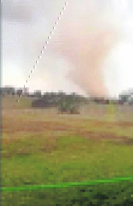 A still from the footage of the mini-tornado captured by 16-year-old Gemma Hollebon near Young  last week.