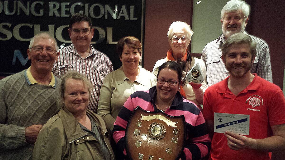 THRILLED: Choir of the Southern Cross committee members basking in their recent Cowra Eisteddfod success.  Back, left to right: Michel de Reeper, Murray Russell, Carole Clark, Jenny de Reeper and Fred Dimmick. Front, left to right: Christine Emmett, Tracey Clark holding the Sacred Choral shield and musical director Rodney Clancy.    
