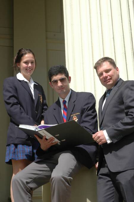Young High School captains Jemma Long and Hassen Chemiet with principal Keith Duran talk tactics ahead of the 2015 HSC examinations, which start Monday.