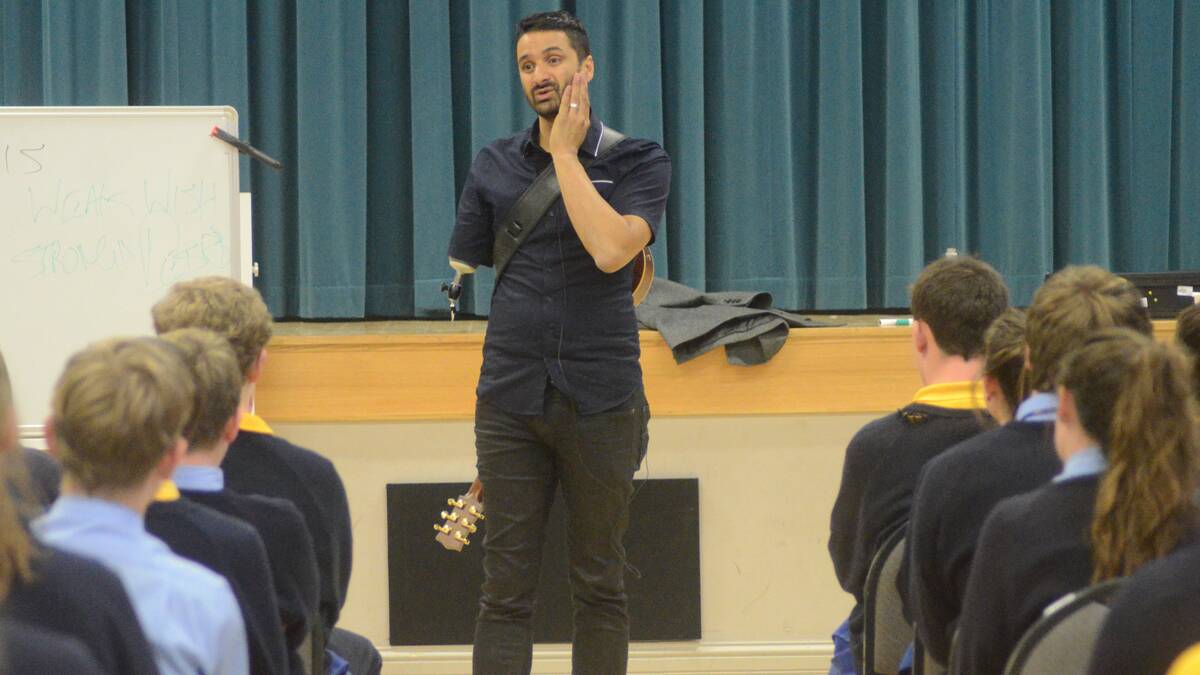 INSPIRING: Sam Cawthorn speaks to Hennessy Catholic College students at Young Town Hall on Wednesday.  