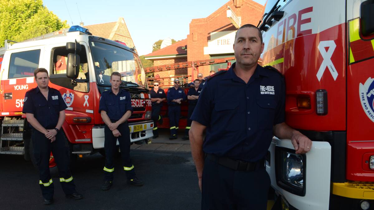 STAND: Newly appointed deputy captain Dick Donges and his fellow firefighters from Young Fire and Rescue NSW took the oath on White Ribbon Day on Wednesday to end violence against women. 