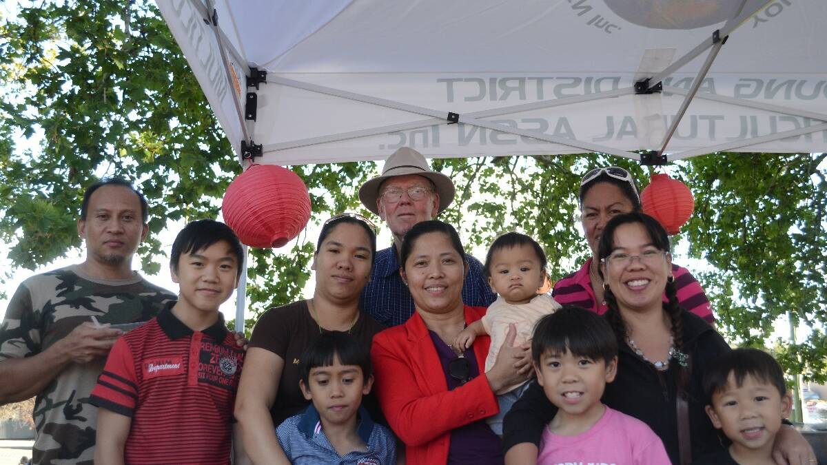 POPULAR: Young and District Multicultural Association members (from left to right) Rey Surilla, Patrick Le, Roselyn and Nicholas Surilla, Michael Mercer, Wilma Obrien, baby Ethan Surilla, Joy Carter-Karajcic (obscured), and Derwin, Vanessa and Roderick Le, were overwhelmed by the response their cuisine market stall received during the Lambing Flat Chinese Festival on April 12. 	