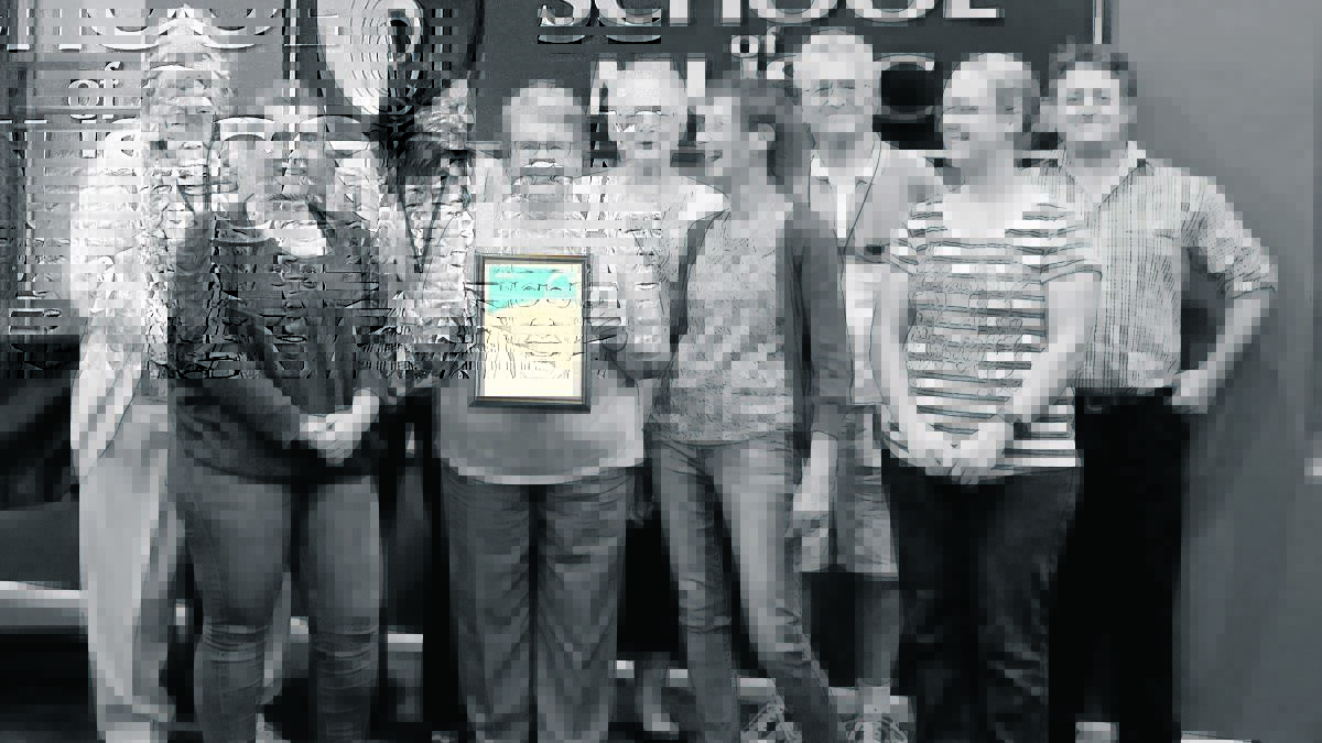 REASON TO CELEBRATE: Young Regional School of Music tutors (back row, left to right) Margaret Edwards, Liz Boland, Penny Ricketts, John Willems and James Cronin (CEO) with (front row, left to right) Leisa Kenny, Yvonne Tredinnick, Jennie Peady and Jess Charles after being presented with their certificate of distinction.
Matt Ricketts, Stewart Bruce and Rodney Clancy also had exam students but are not pictured.