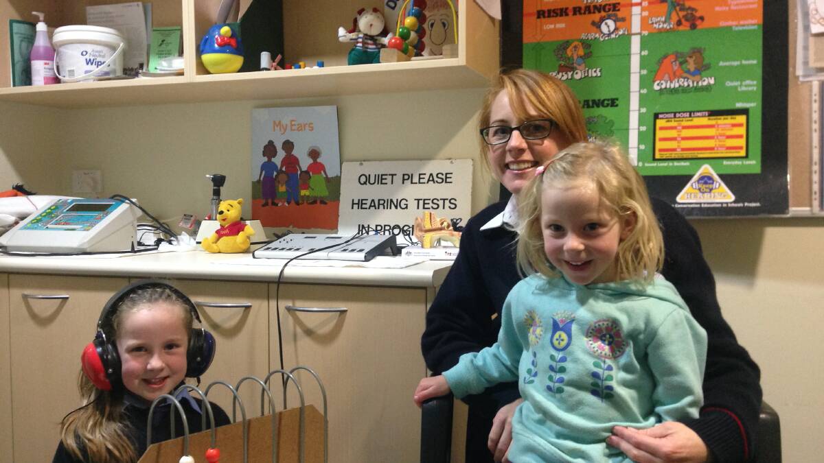 TEST TIME: Lily Brien, her mum Kellie and sister Molly attend the Young Community Health Centre during Hearing Awareness Week.		