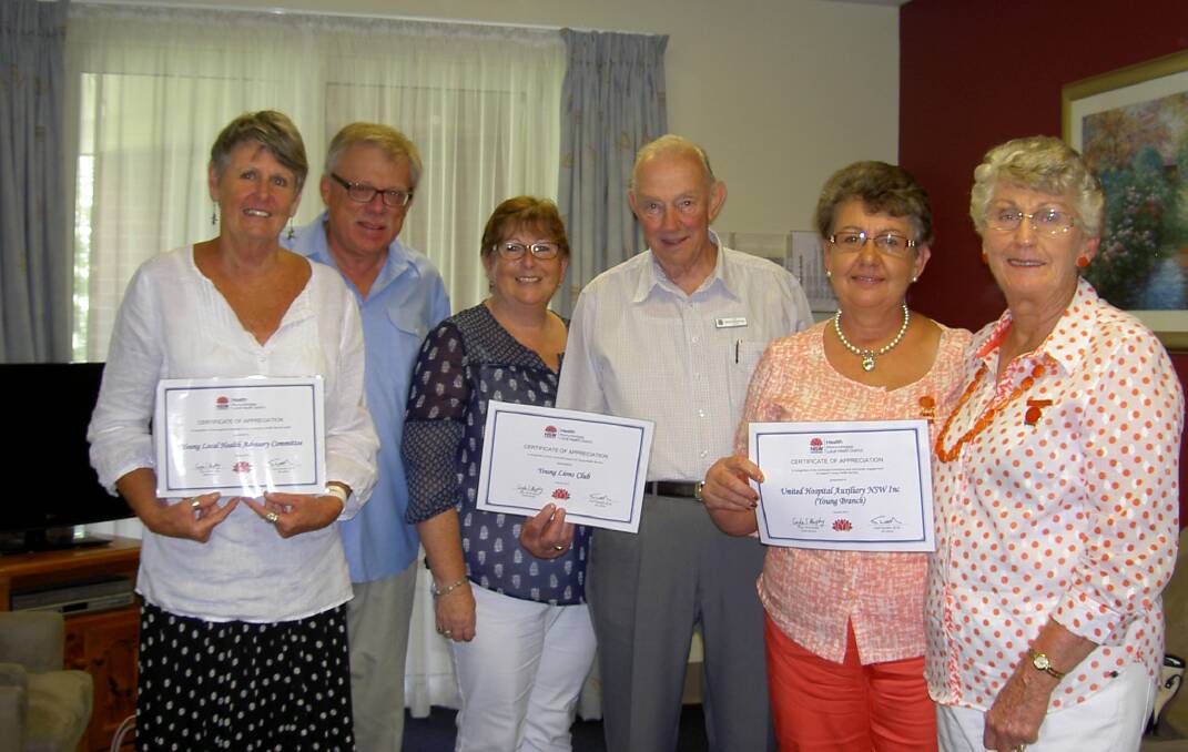 Local volunteers Young Local Health Advisory Committee chairperson Heather Ritchie; local general practitioner and MLHD Board director Dr Tom Douch, Young Lions Club secretary Marie Tame, Young Lions Club president Ron Hampton and representing the United Hospital Auxiliary NSW Inc (Young Branch) president Lynn Freudenstein and Gail Smith receive their certificates of appreciation. 	