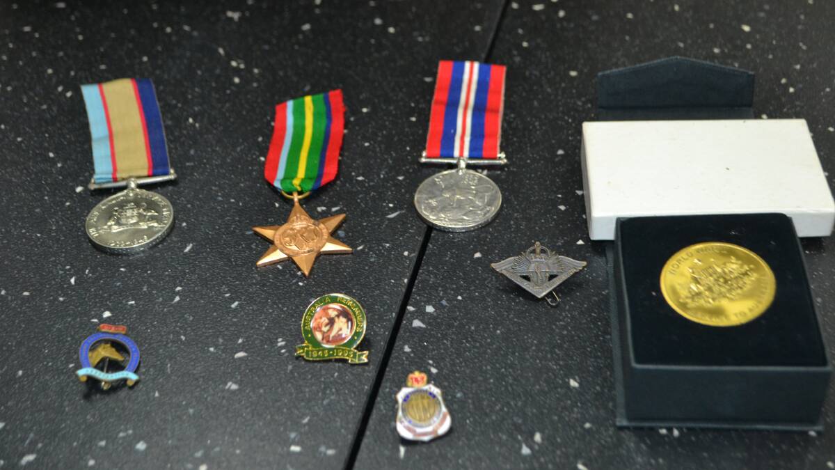 Post-office haste: Medals left on counter spur Moruya mission