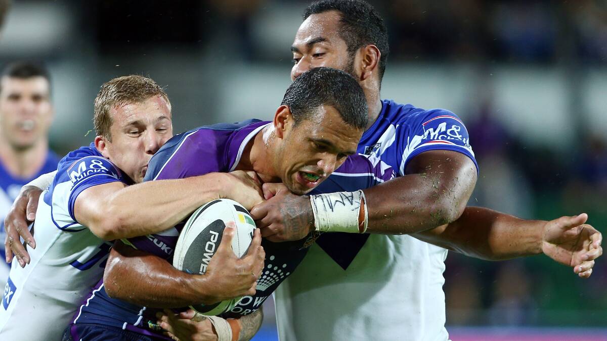 Will Chambers of the Storm is tackled by Trent Hodkinson and Tony Williams. Picture: Getty