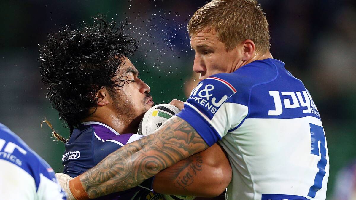 Mahe Fonua of the Storm is tackled by Trent Hodkinson during the round four. Picture: Getty