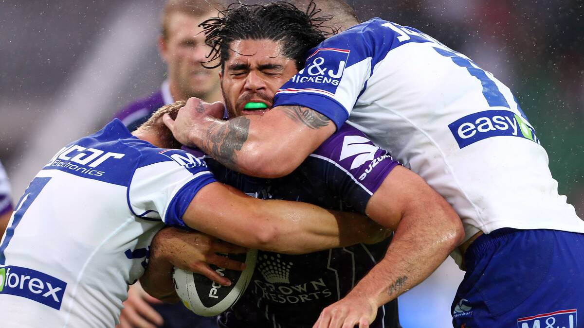Tohu Harris of the Storm is tackled by the Bulldogs defence. Picture: Getty