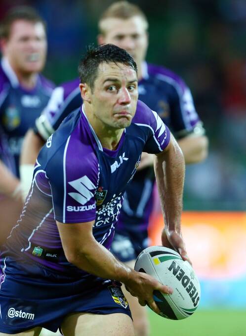Cooper Cronk of the Storm looks to pass during the round four NRL match between the Canterbury-Bankstown Bulldogs and the Melbourne Storm. Picture: Getty