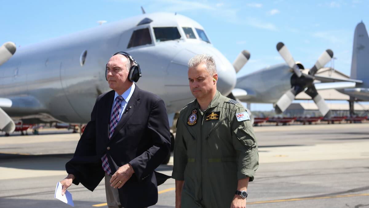 Acting Prime Minister Warren Truss takes a tour of operations at RAAF base Pearce before being shown aboard the Orion before it departs to search for the missing Malaysia Air jet. Picture: Jan Villalon