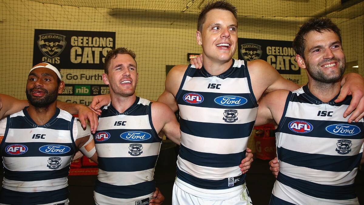 Travis Varcoe, Joel Selwood, Hamish McIntosh and Jared Rivers of the Cats sing the song in the rooms after winning the round three AFL match at the MCG. Geelong ran out 87 points to Collingwood's 76. Picture: Getty Images