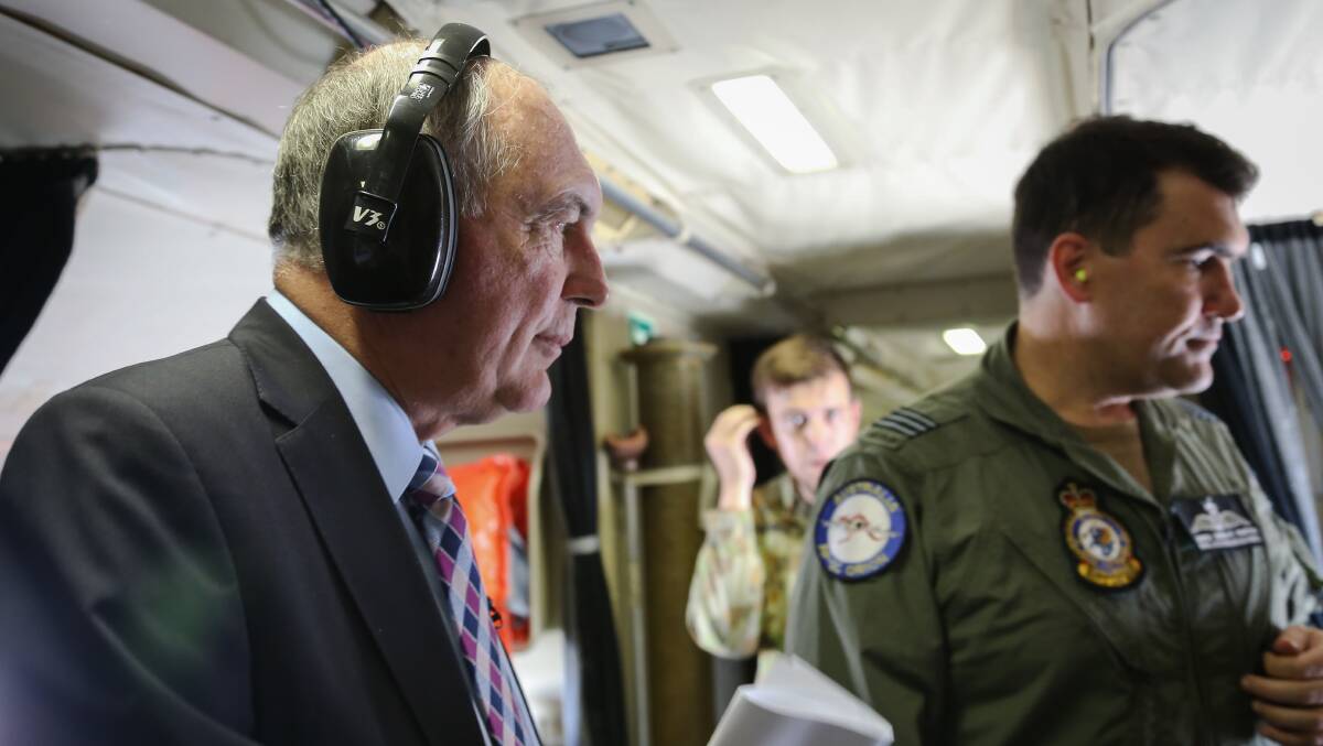 Acting Prime Minister Warren Truss takes a tour of operations at RAAF base Pearce before being shown aboard the Orion before it departs to search for the missing Malaysia Air jet. Picture: Jan Villalon