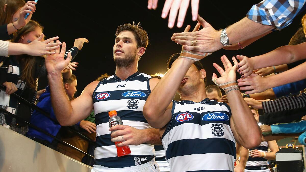Tom Hawkins and Mathew Stokes of the Cats high five fans after winning the round three AFL match at the MCG. Geelong ran out 87 points to Collingwood's 76. Picture: Getty Images