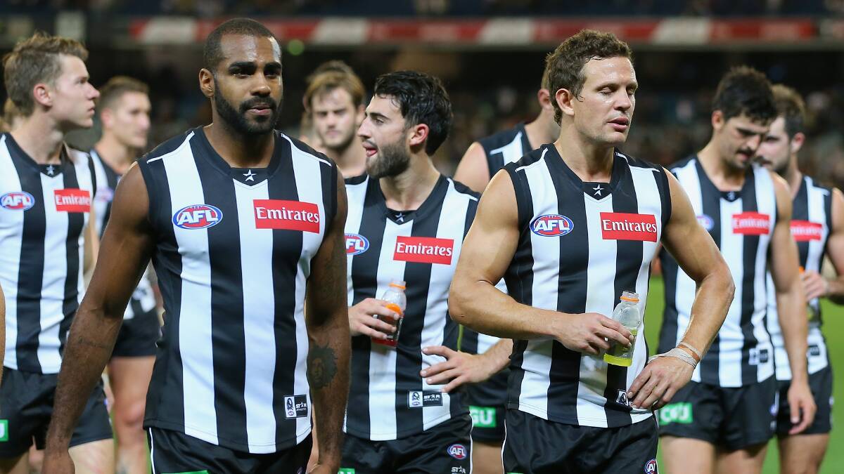 The Magpies look dejected as they leave the field after losing the round three AFL match at the MCG. Geelong ran out 87 points to Collingwood's 76. Picture: Getty Images