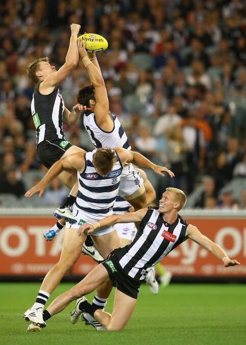 Jimmy Bartel of the Cats marks infront of Tom Langdon of the Magpies at the MCG. Geelong ran out 87 points to Collingwood's 76. Picture: Getty Images