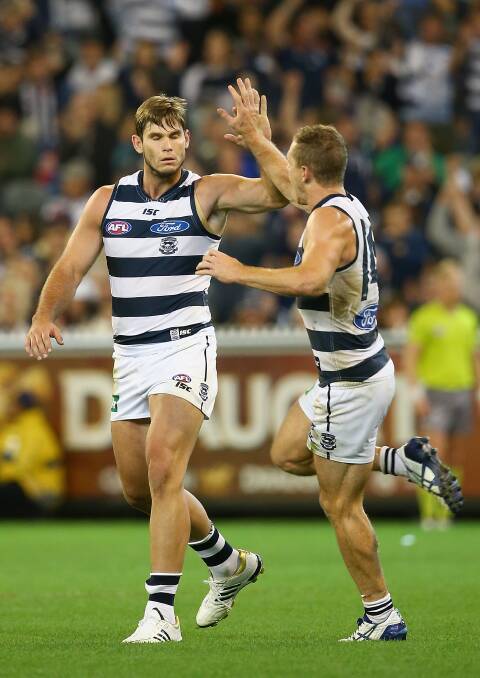 Tom Hawkins of the Cats is congratulated by Joel Selwood at the MCG. Geelong ran out 87 points to Collingwood's 76. Picture: Getty Images