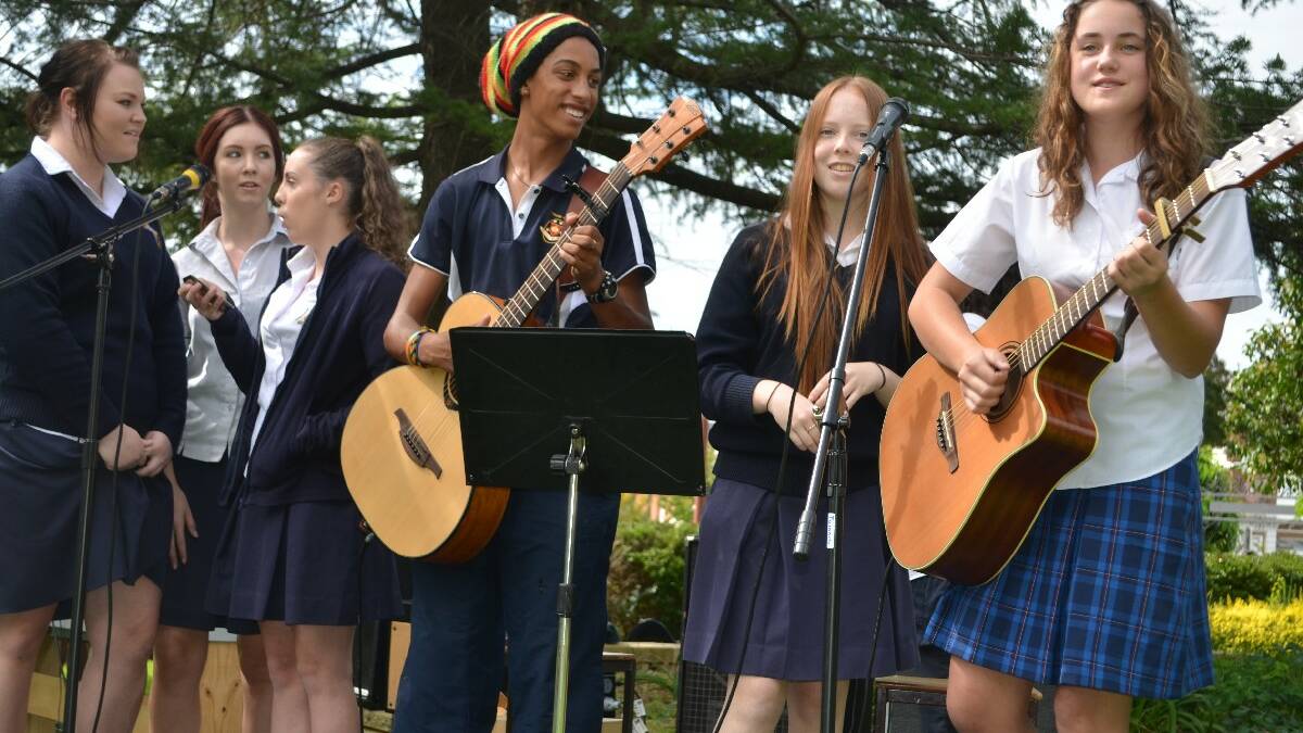 ENTERTAINMENT: Jess Barton, Hannah Corcoran and Vanessa Mitchell from Hennessy Catholic College joined Young High student Will Ozurumba, Holly Cormack (Hennessy) and Lucy Caldow (Young High) in entertaining the crowd.	