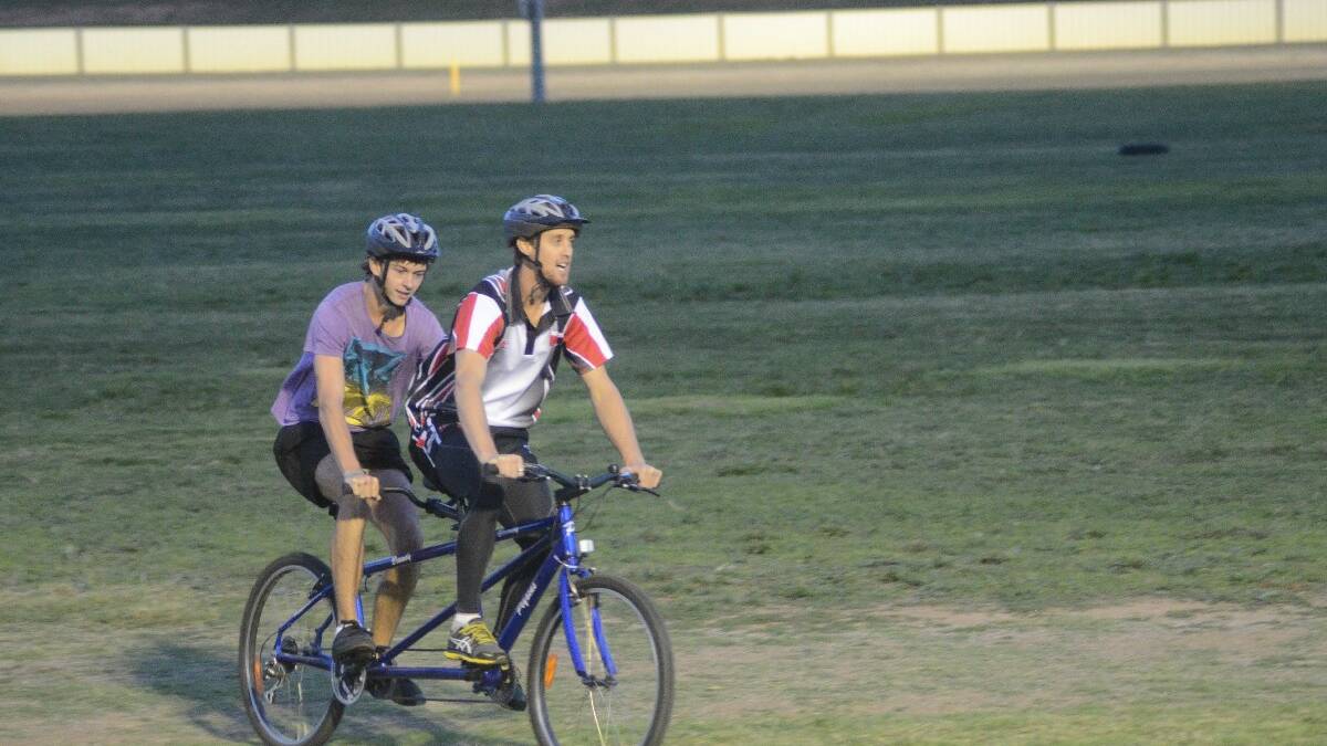WINNERS: The Young Saints AFL Club were winners of the novelty two-man bike race between them and the Young Cherrypickers Rugby League Club at the meeting, scoring themselves $500 in prizemoney.