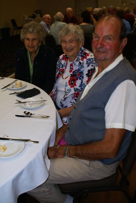 FAMILY: Sisters Annie Trudgett and June Woods dine with brother Gordon Jarrott at the  Seniors Week lunch at the Young Services Club.