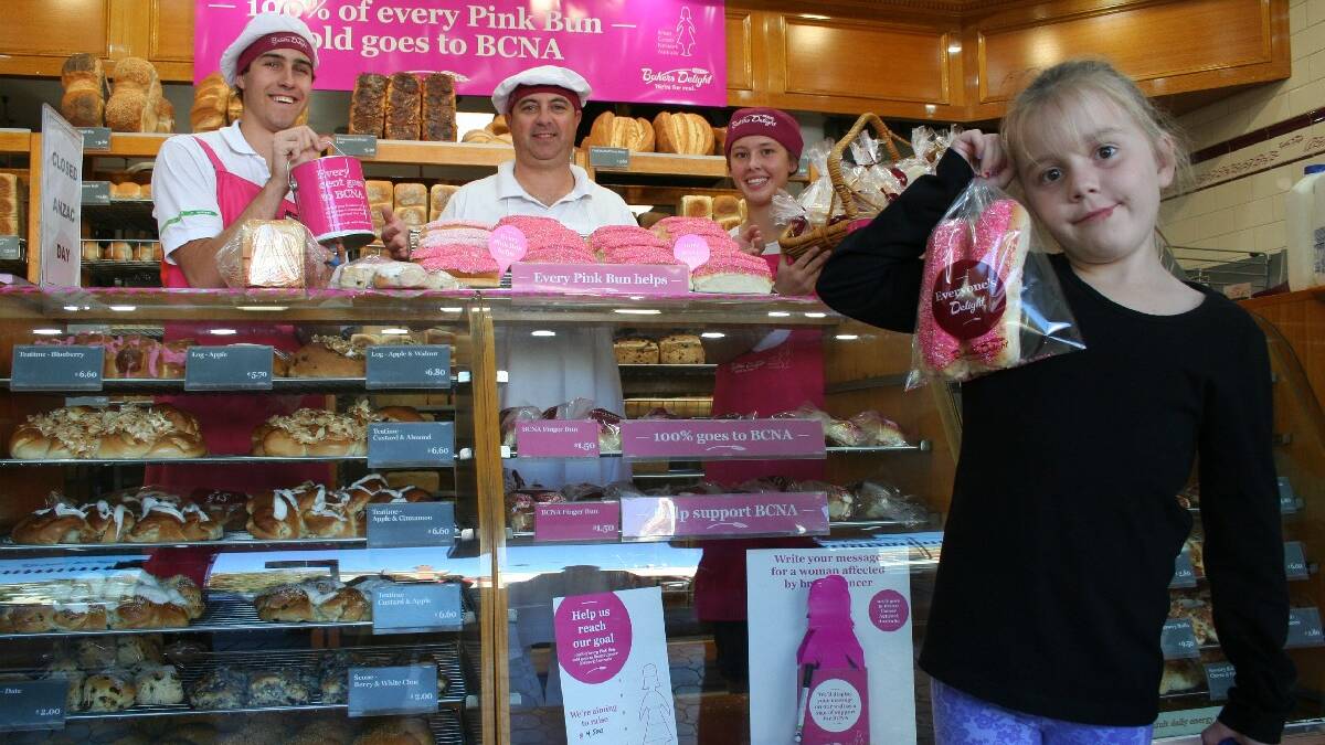Pink Buns saving lives: Young bakers are rolling up their sleeves to help raise $1.5 million for Breast Cancer Network Australia (BCNA) in this year’s Pink Bun Campaign. Hayley Sims (8) was a happy customer when she purchased some pink finger buns from Sam Langfield, Ron Rosengreen and Jemma Long.