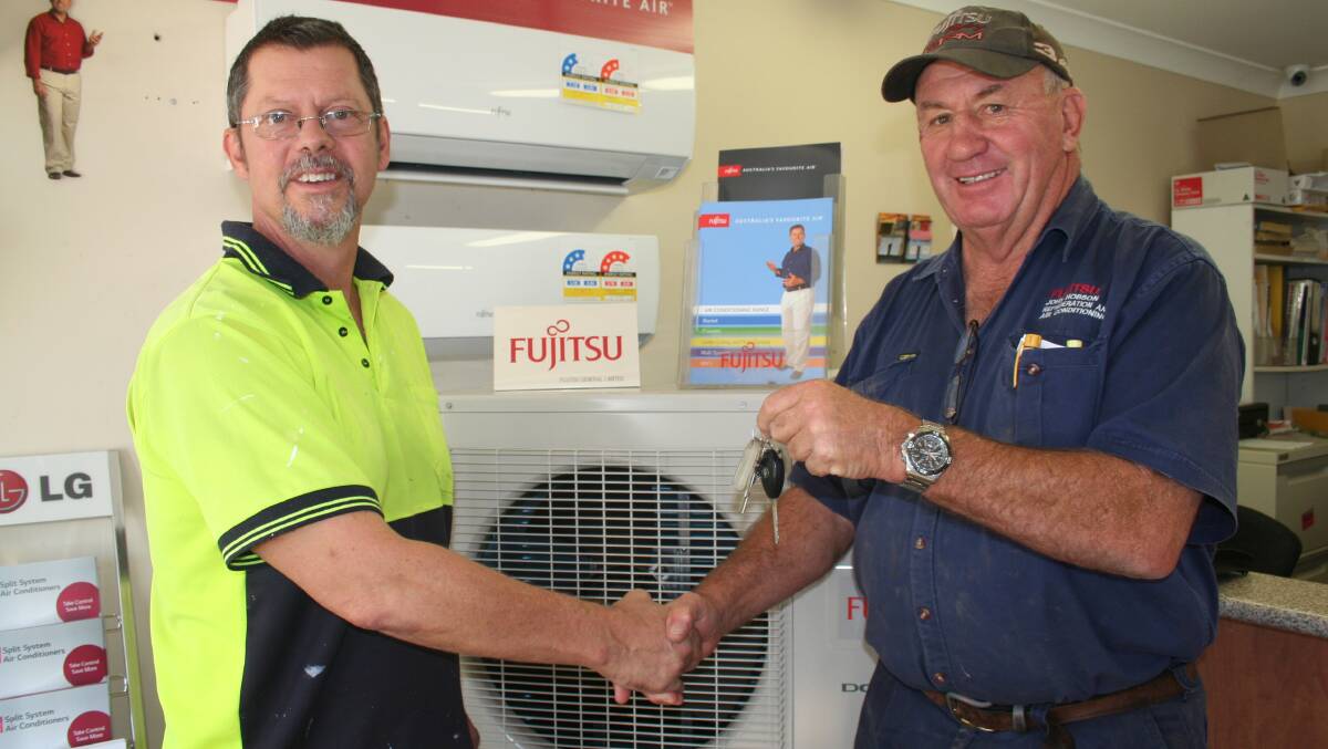 WINNER: Jim Bailey of Young was one of 10 people in Australia to win a new $29,000 KIA Sportage SUV after buying a new air conditioner from John Hobson at John Hobson Refrigeration and Air Conditioning in Lovell Street. 