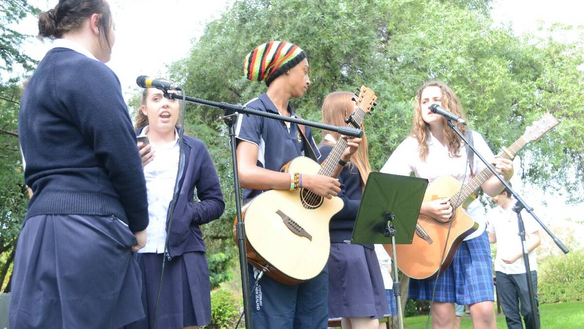 ENTERTAINMENT: Jess Barton and Vanessa Mitchell from Hennessy Catholic College joined Young High student Will Ozurumba, Holly Cormack (Hennessy) and Lucy Caldow (Young High) in entertaining the crowd.	