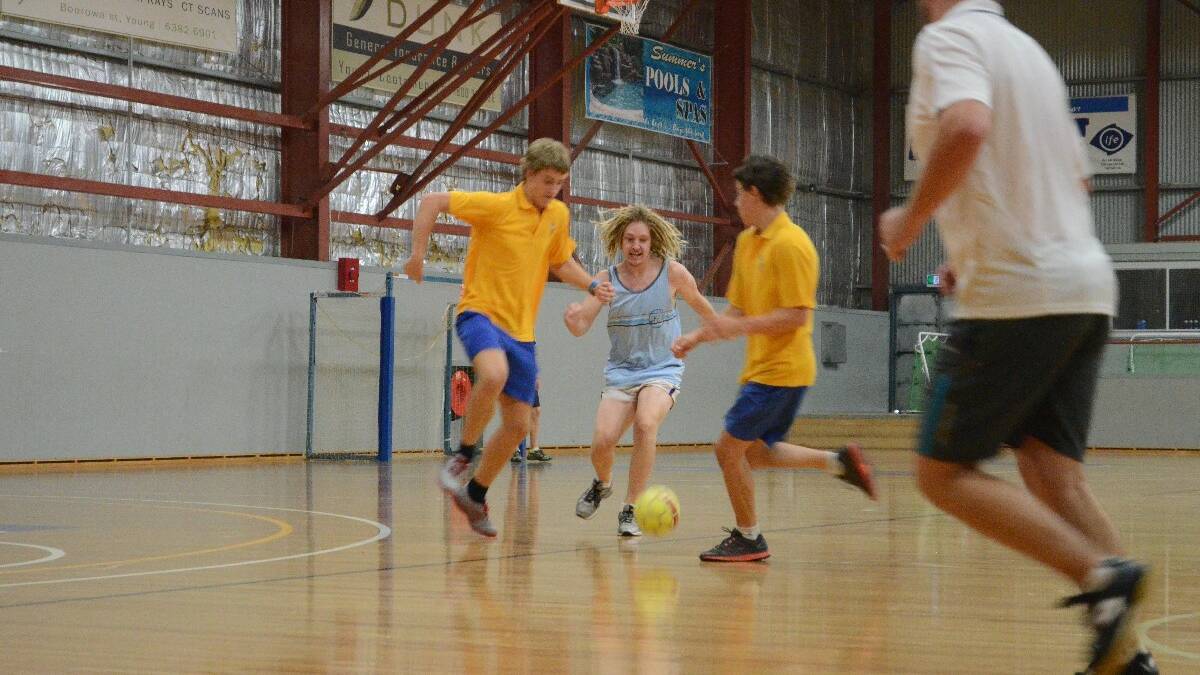 OUTNUMBERED: PCYC Activity Officer Benny Wallwork (centre) takes on the opposition.