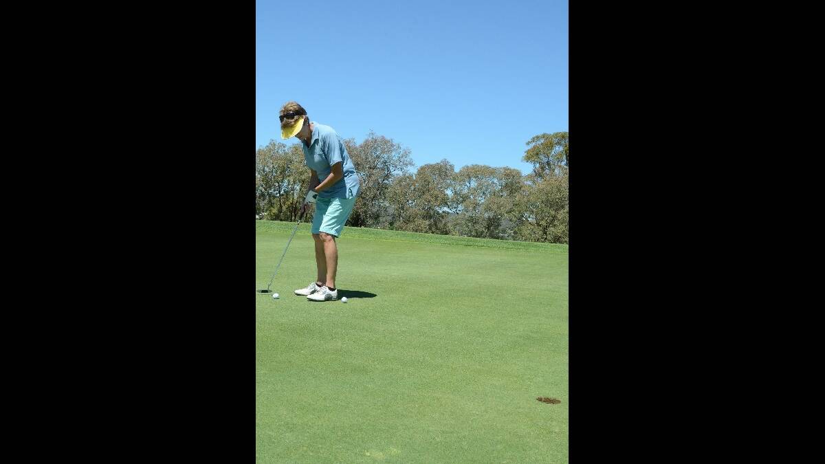 PUTT: Joy McCormick havin' a go at the 000 Emergency Services Golf Day last Friday.