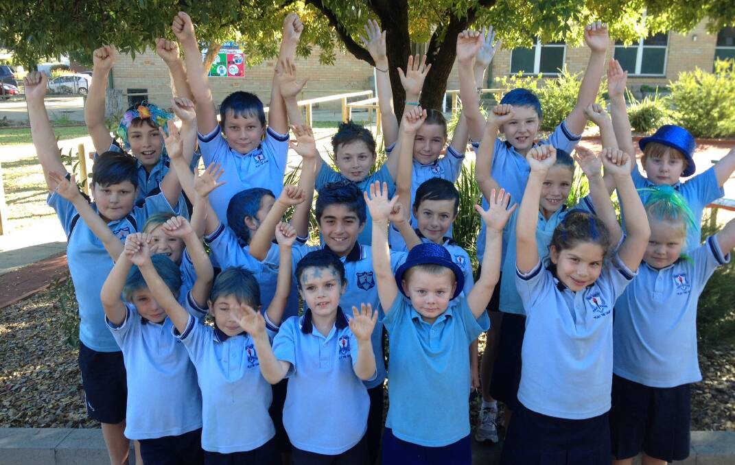 Young North Public School students raise awareness of autism by wearing blue.