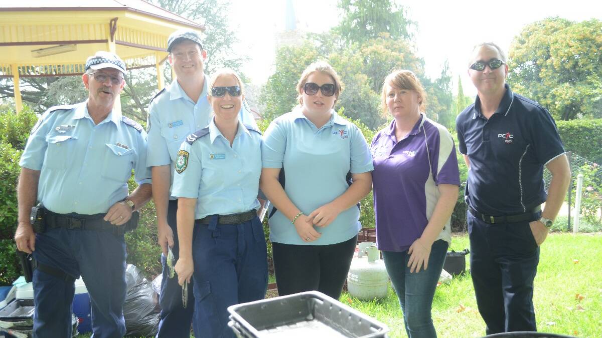 HERE TO HELP: On hand for the day were Sergeant John Waples, Senior Constable Brendan Clark, Senior Constable Karen Clark, Katelyn Crisp from the Young PCYC, Tania Jones from Campbell Page Youth Connections and Young PCYC manager Martin Langfield.