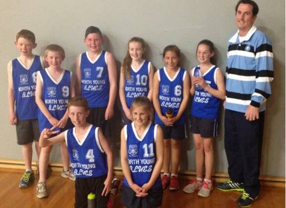 EXCELLING: Mr Collins with the Stage 3 Young North team.