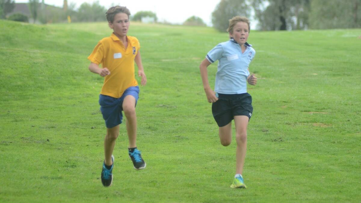 SPRINT: Students from each school entered into friendly rivalry sprints at the finish line, as did this pair (right) Max Kirkwood from St Mary’s and Duke Smith-Maloney from Young North.
