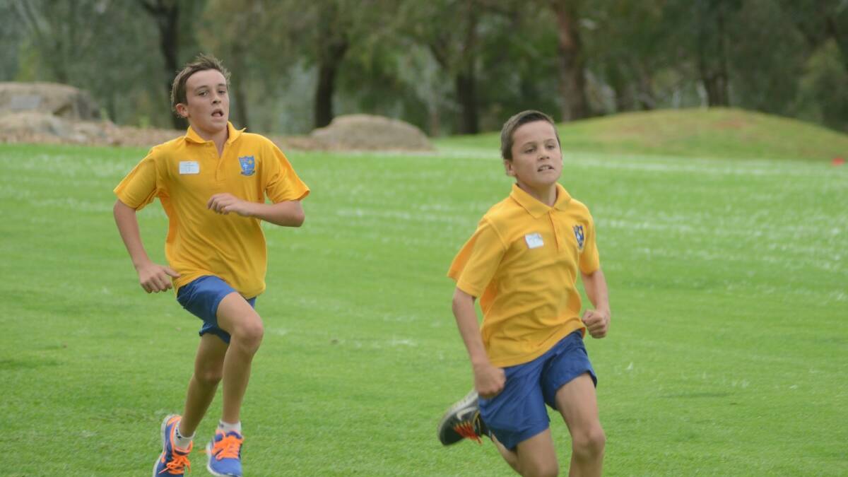 11 YEARS: Kai Langfield (right) leads the way with Riley Brownlie (left) not far behind.
