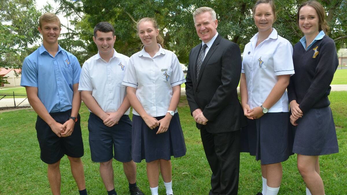 PROUD: Hennessy Catholic College principal Dr Peter Webster (third from right) couldn’t be more proud of this year’s selection of scholarship winners, (from left to right) Brent Shoard, Clancy Potts, Samantha Doolan, Kate Lehane and Isabel Gahan.