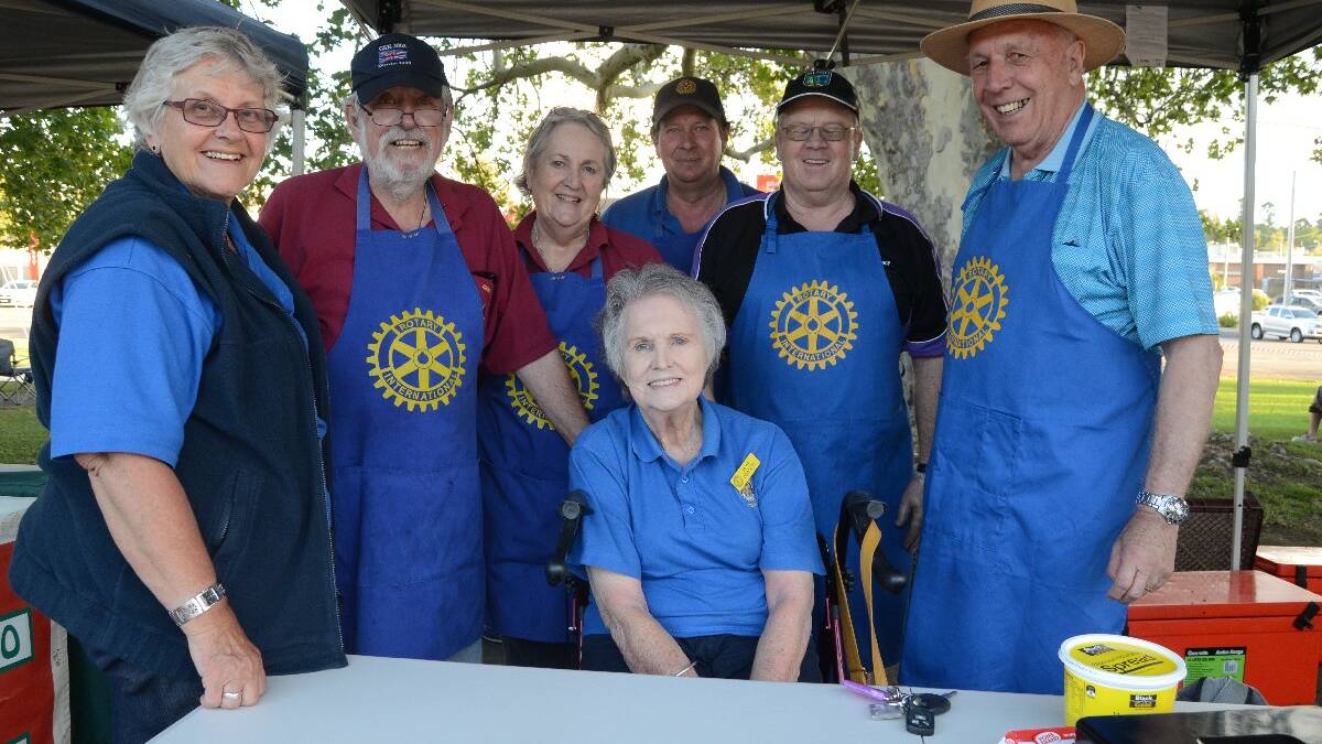 STALL: Jan Martin, Graham and Margaret Fathers, Paul Sheather, Ted Loader, Cliff Sheridan and Rotary president Irene Dowsett (front) at their stall. 