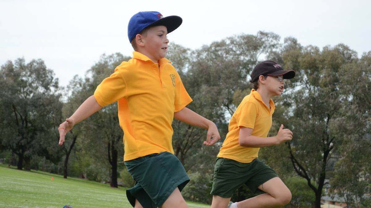 CROSS COUNTRY: Year 3 students Darcy Hannick and Liam Tierney taking part in Young Public School’s cross country event at the Young Golf Club.