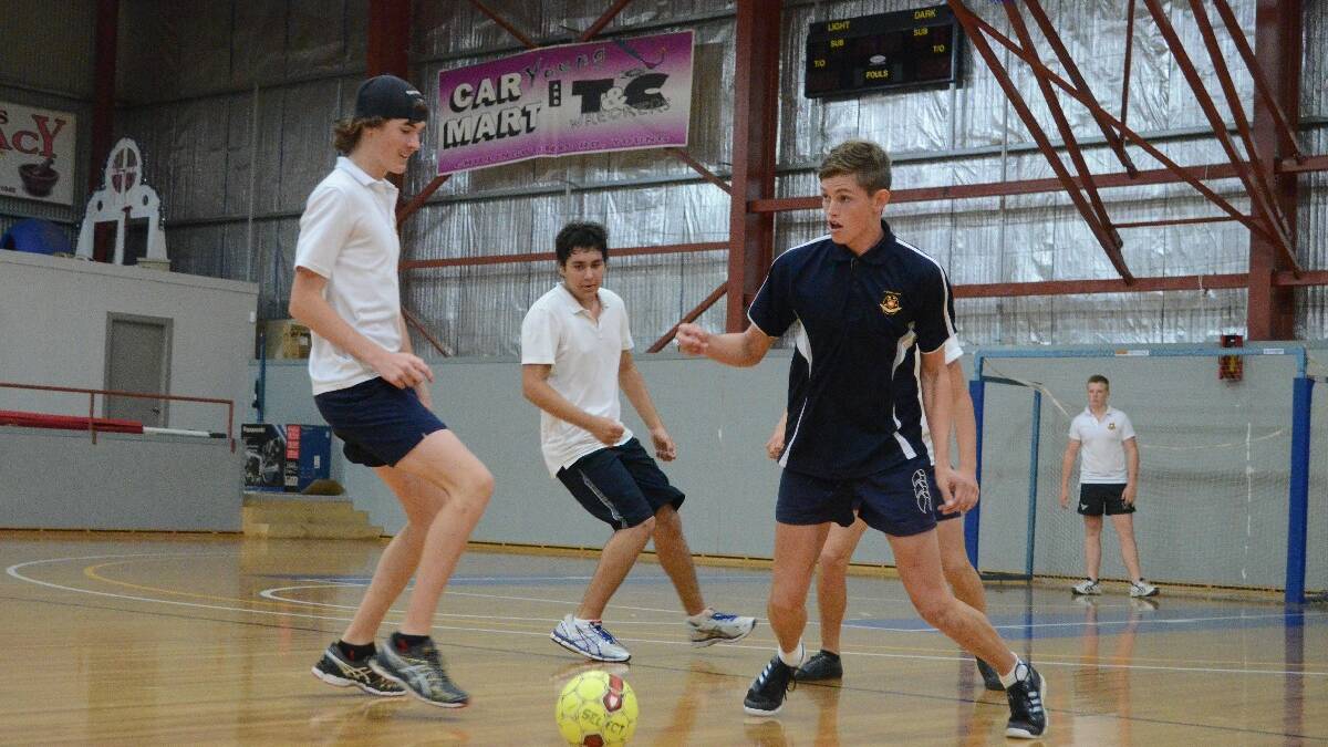 TAKE COVER: Young High School’s Nathan Anderson gets ready to clear the ball during a gala day event at the Young PCYC. 	