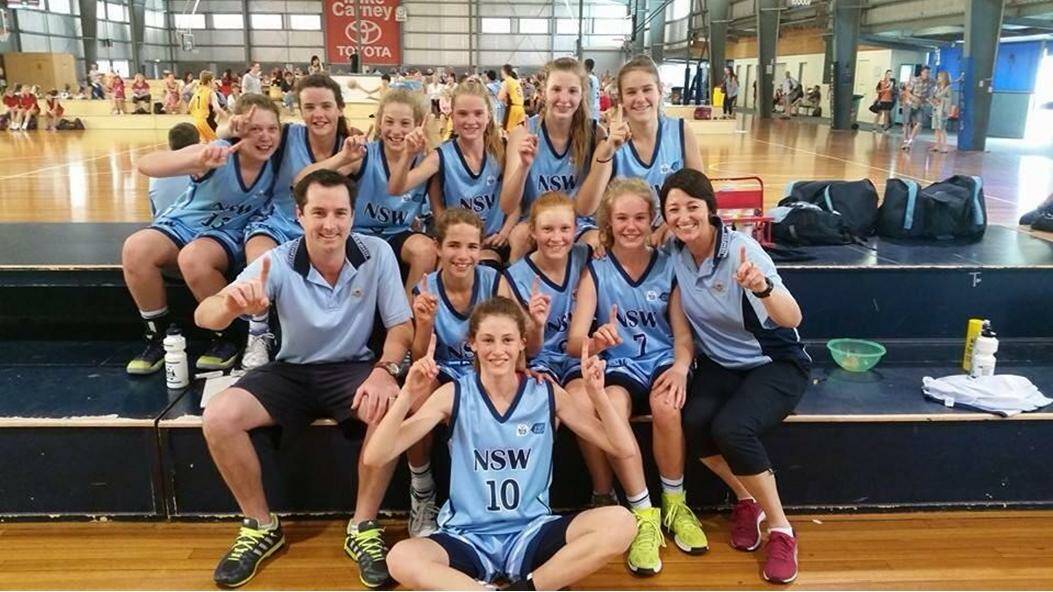 CHAMPIONSHIPS: Damian Collins with the undefeated NSW PSSA girls team in Townsville at the National Championships.