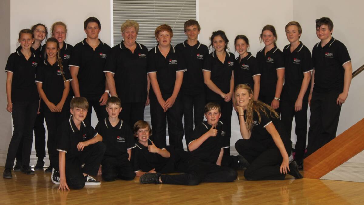 ON TOUR: Some of the members of the Riverina Touring Band. Front, left to right: Brady Noyes, Lewis Taylor, Cameron Steele, Reid Noyes and Freya Steele. Back row, Left to right: Brooke Windsor, Tessa Watson, Tilly Metcalfe, Georgia Richens, Nick Boland, conductor Di Hall, Johnny Hosken, Liam Wymer, Tessa Long, Brianna Long, Cassie Boland, Elliot Dodd and Lachlan Dodd.