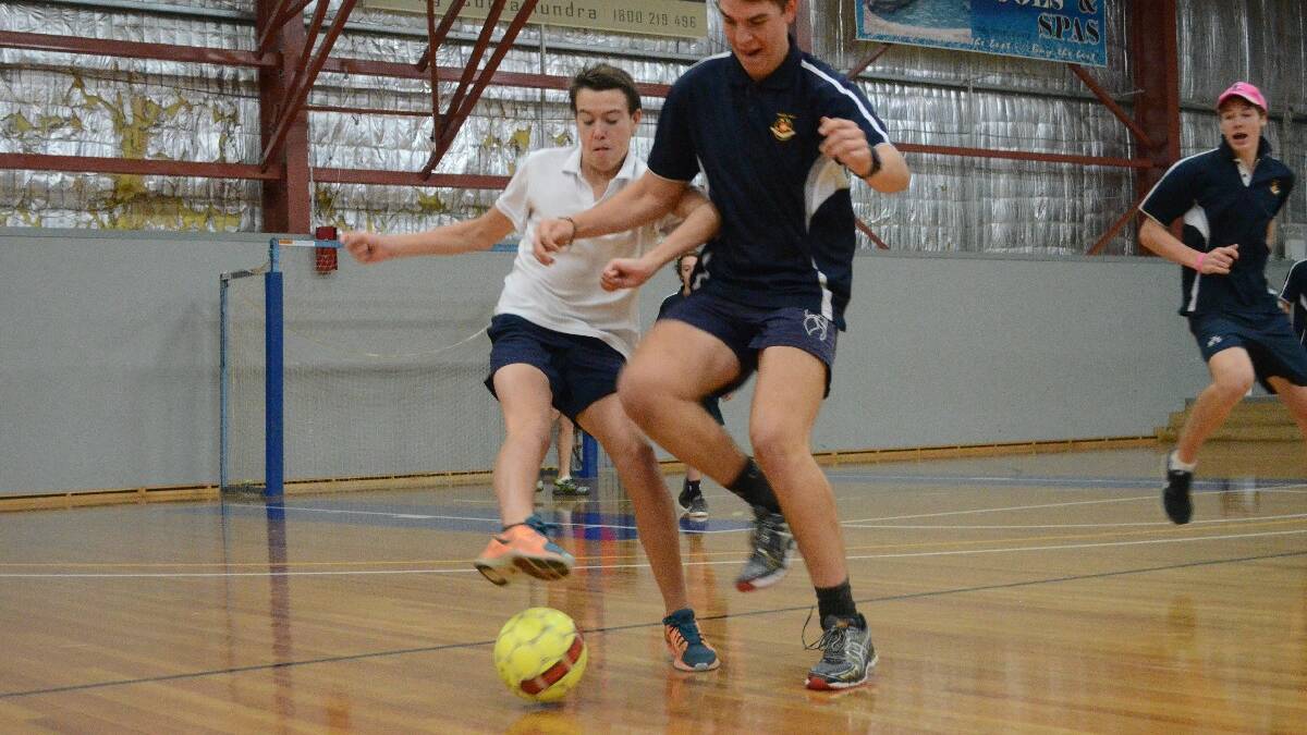 Cootamundra High School’s Ben Camelleri and Young High’s Joel McKenzie fight for the ball.