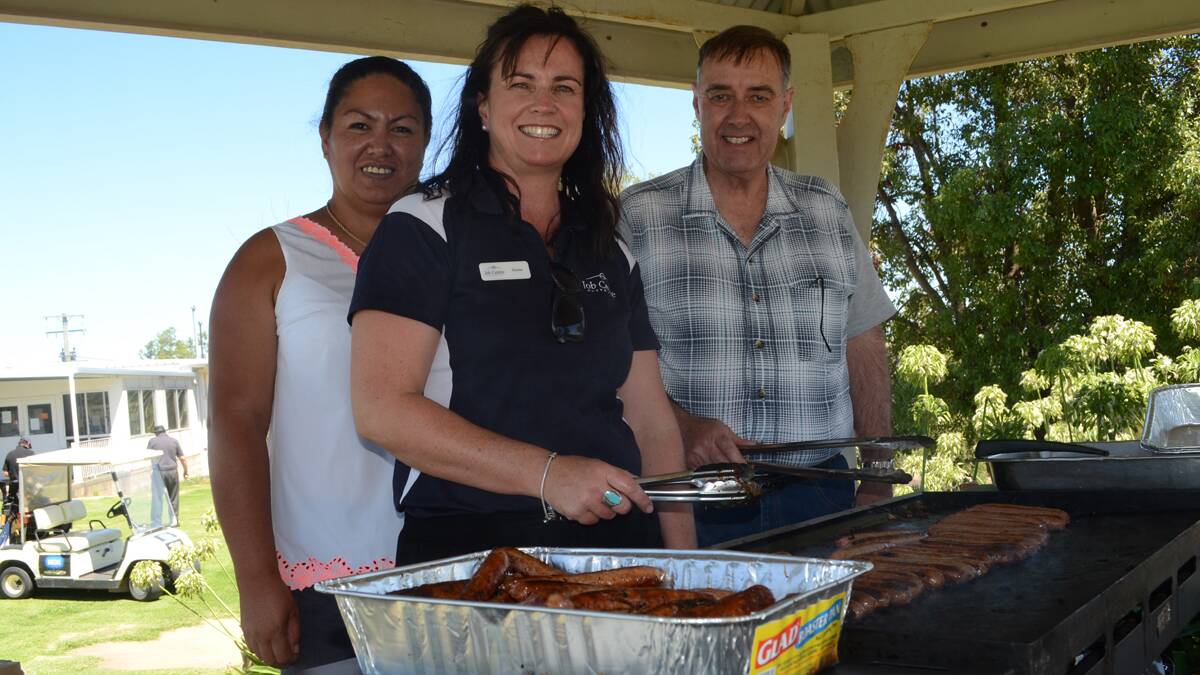 WHO WE’RE DOING IT FOR: Joy Carter, Deena McGregor and Murdoch MacDonald from Young Food Hall working the barbecue. Some of the proceeds from the day will be going to their cause.