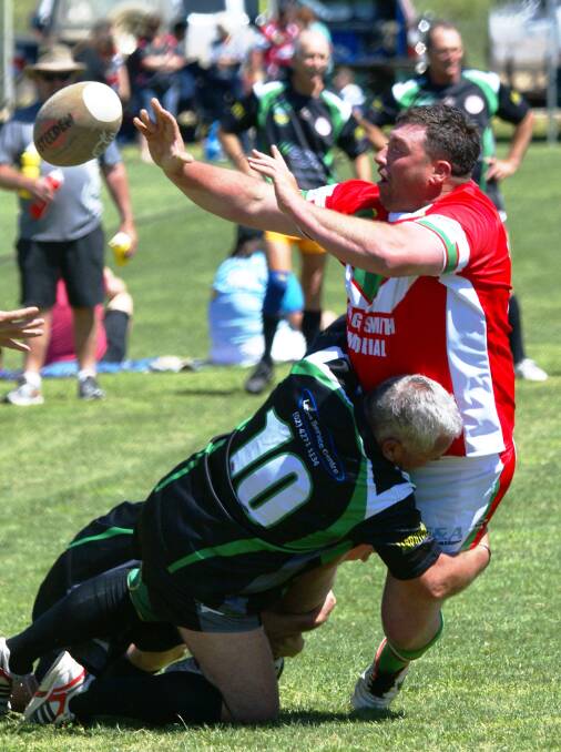 GOOD SPIRIT: Rob Bennett-Brown from Murringo was tackled by Ian Bannerman from Wollongong. Photo by Paul Neville