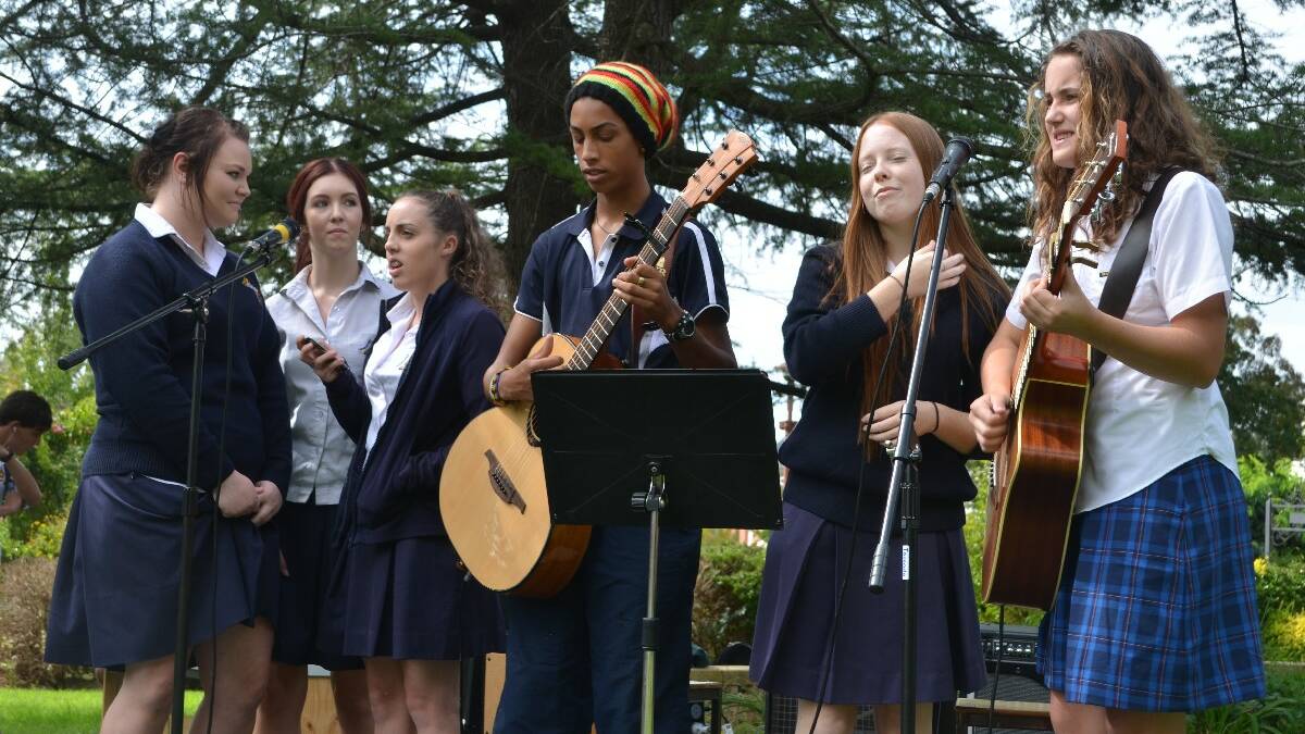 ENTERTAINMENT: Jess Barton, Hannah Corcoran and Vanessa Mitchell from Hennessy Catholic College joined Young High student Will Ozurumba, Holly Cormack (Hennessy) and Lucy Caldow (Young High) in entertaining the crowd.	